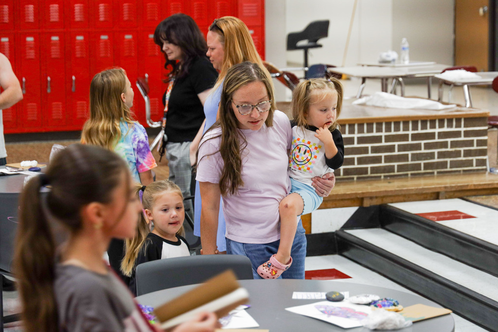 Parents at art camp showcase.