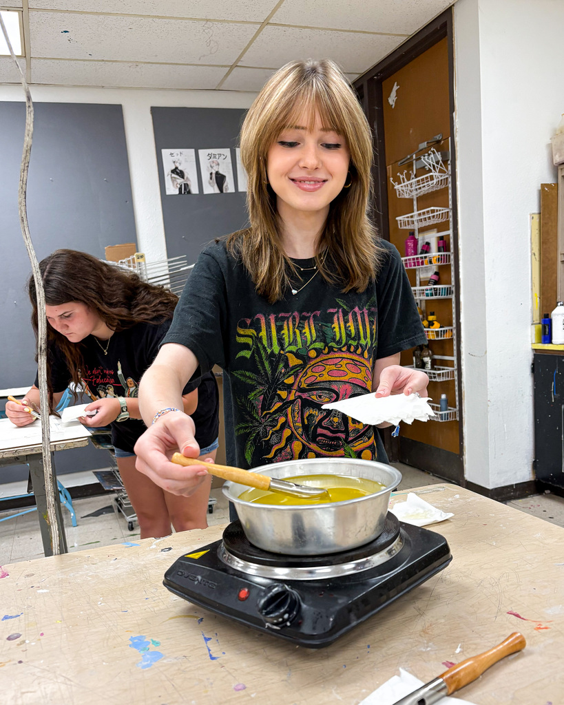 Student working on projects at art camp 2026.