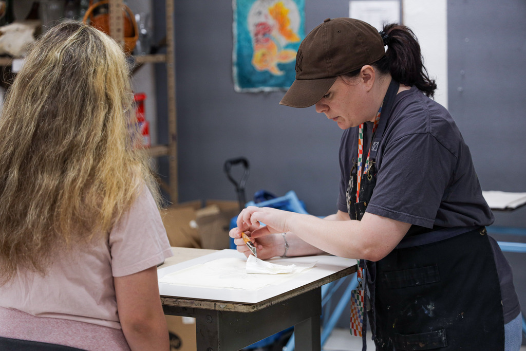 Student working on projects at art camp 2026.