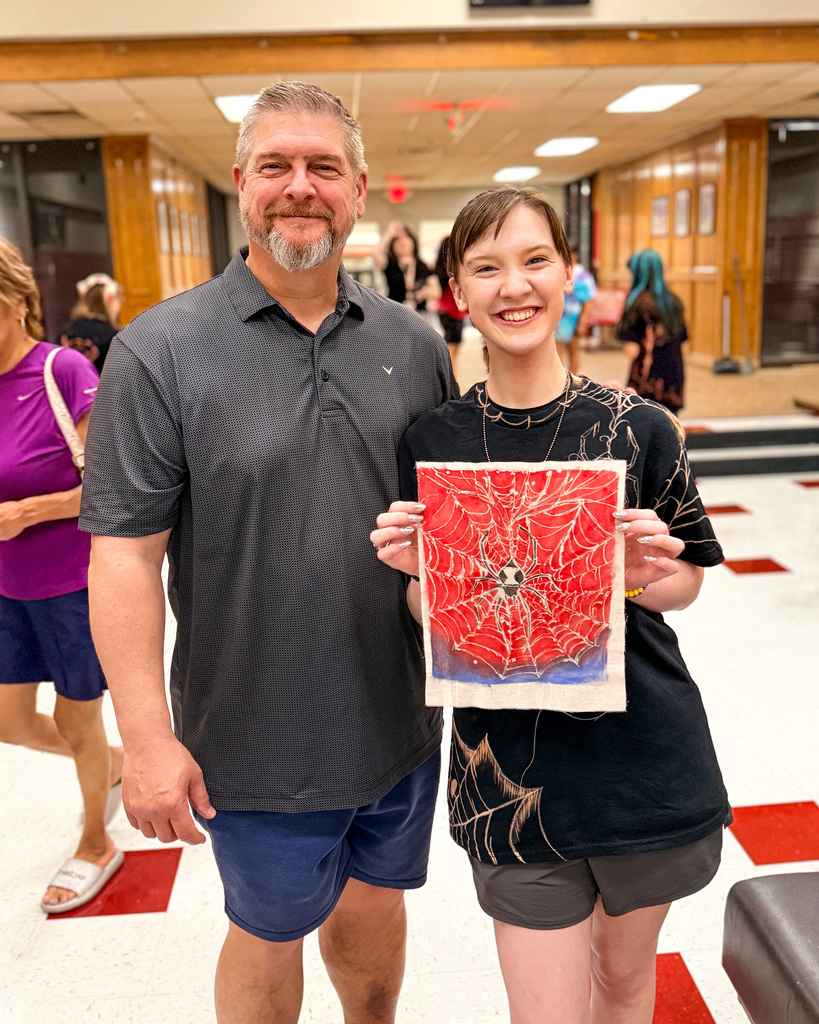 Parents at art camp showcase.