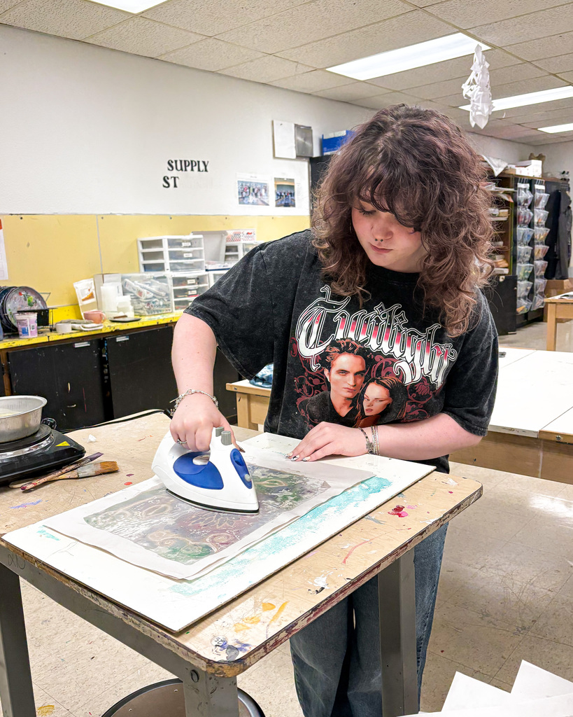 Student working on projects at art camp 2026.