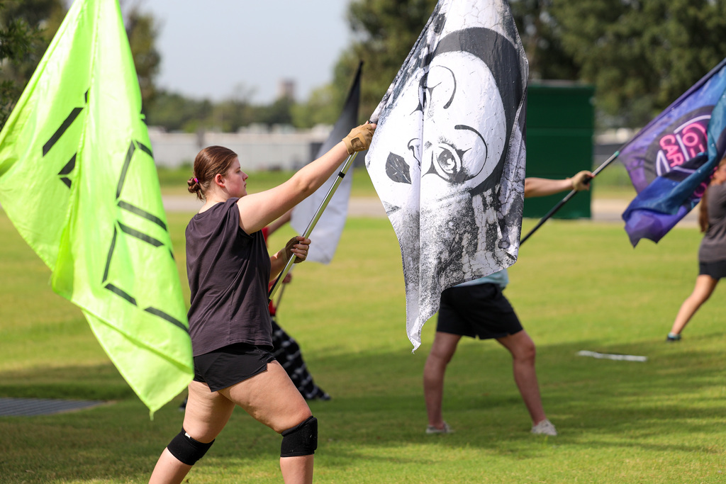 Color Guard practicing outside.