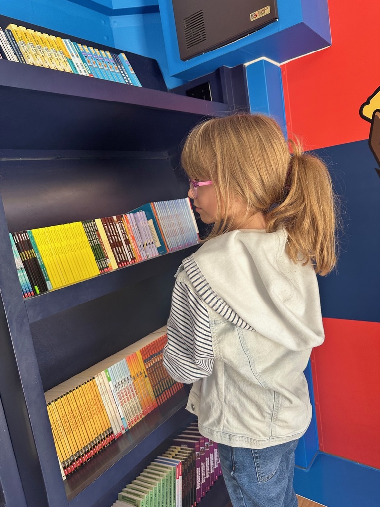 student looking at books