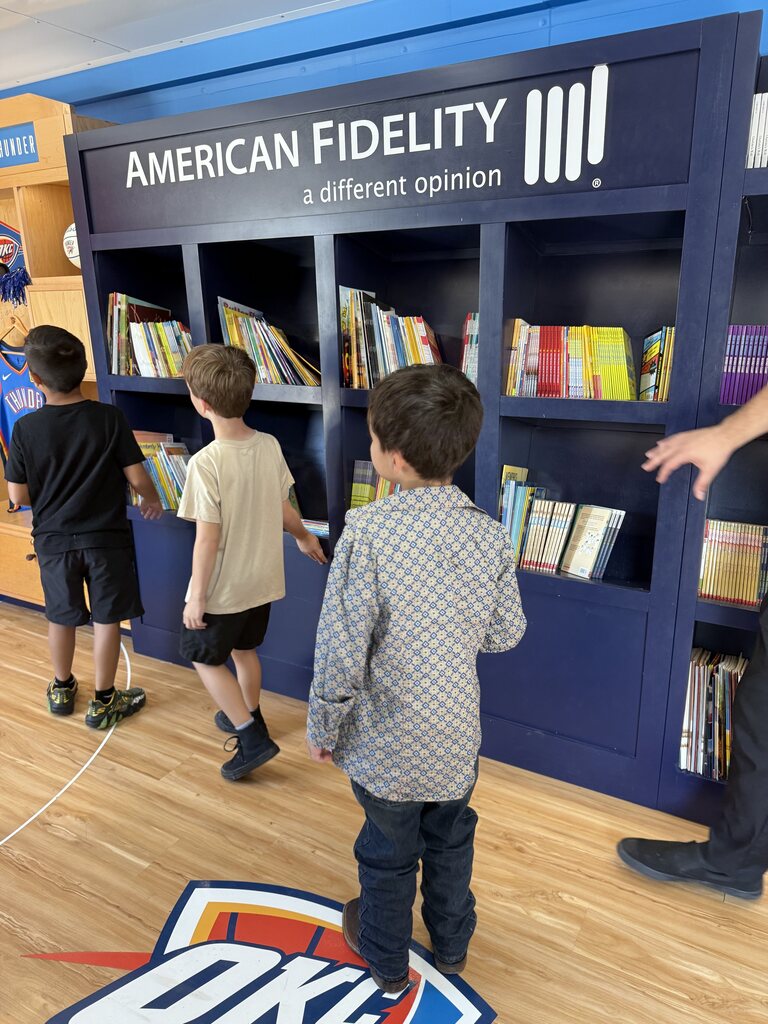 students looking at books