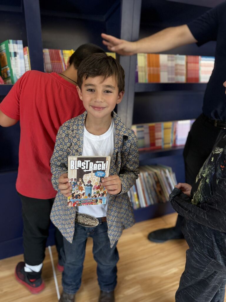 student holding a book