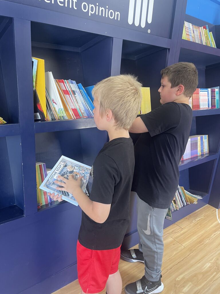 students looking at books