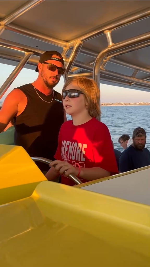 boy driving a boat
