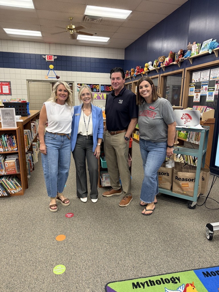 principals and rcb staff smiling in the library