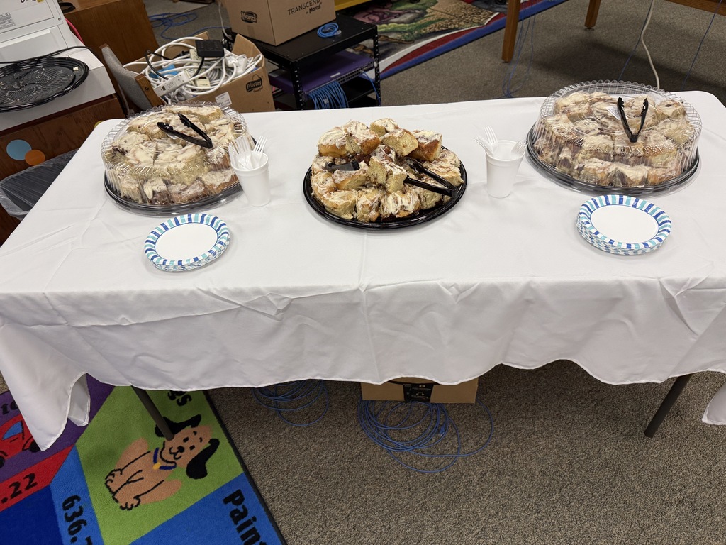 Delicious cinnamon rolls on table