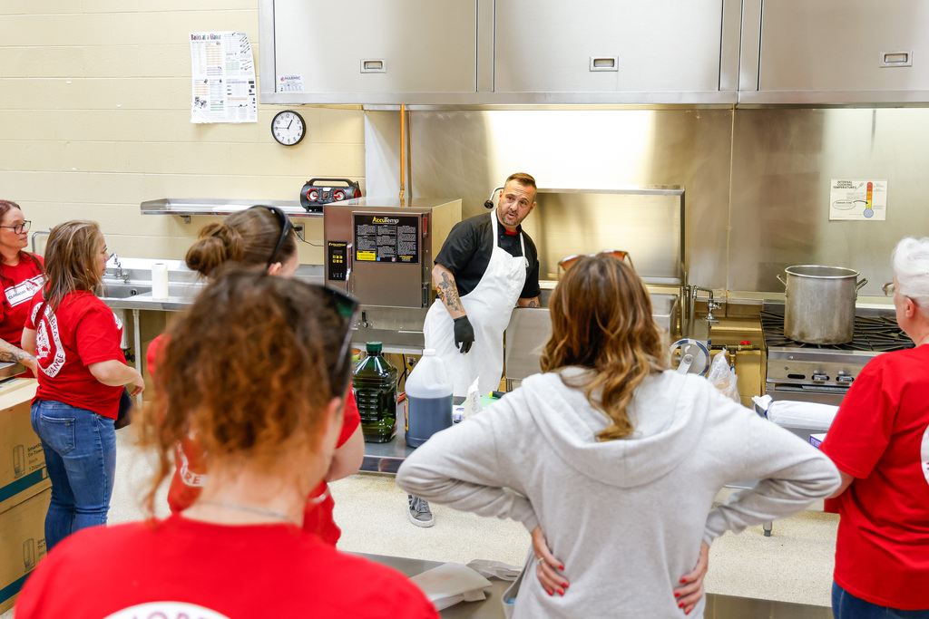 Chef Ryan training managers and cooks on new equipment.