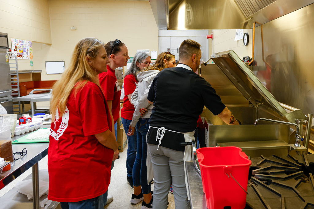 Chef Ryan training managers and cooks on new equipment.