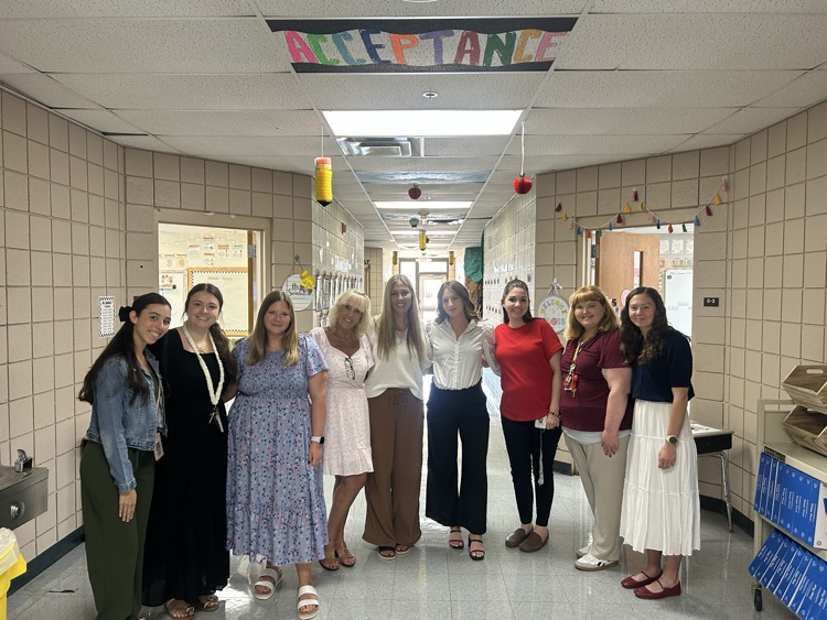 teachers posing for photo 