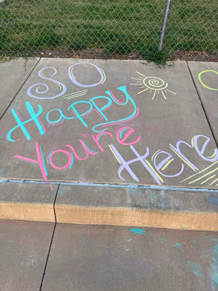 chalk saying so happy you’re here