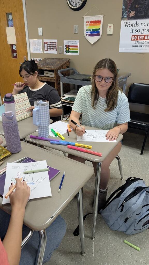 What happens when students stop settling for “good enough” words? They get creative. In Mrs. Andrews's Creative Writing class at CHS, students are sharpening their word choice through hands-on activities: decorating hands with powerful verbs and using tiny 1-inch-by-1-inch frames to zoom in on the world around them. The challenge? Look closely. Notice the minute details. Choose precise, vivid words that bring those details to lifebecause powerful writing starts with powerful words.