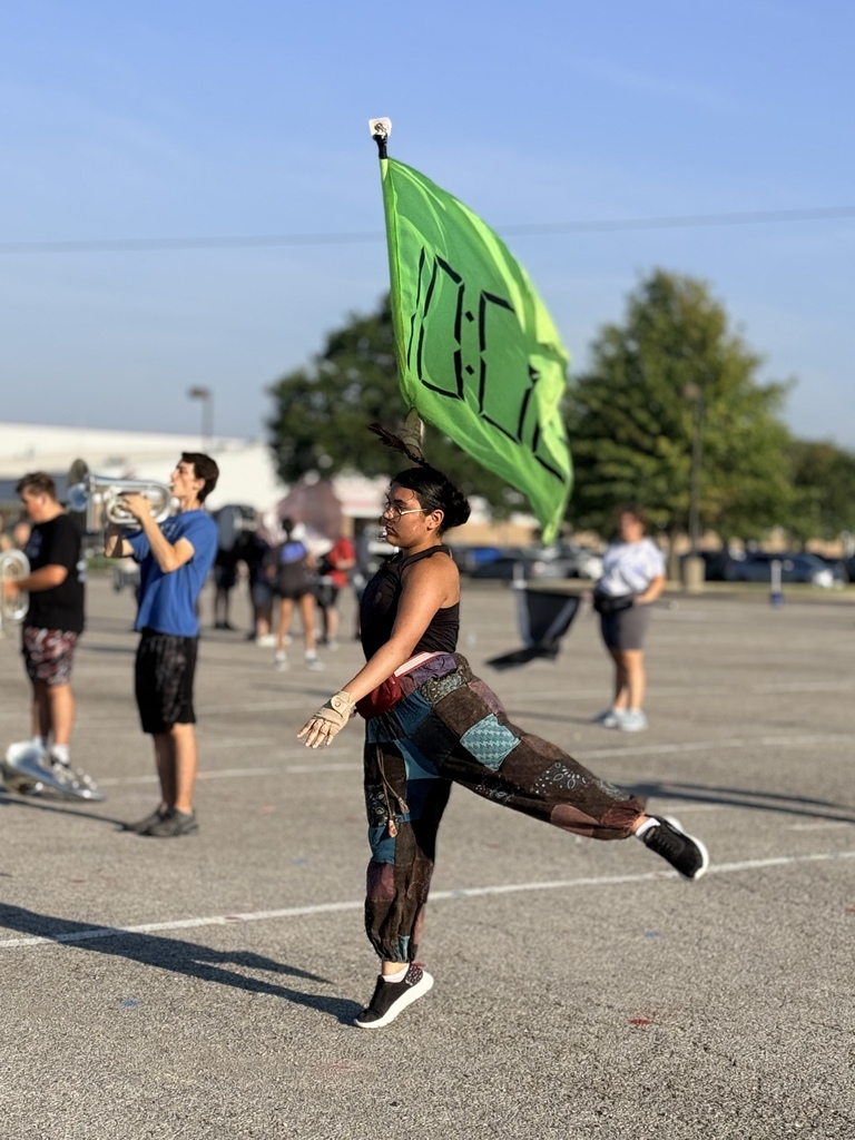 Colorguard student working hard at practice.