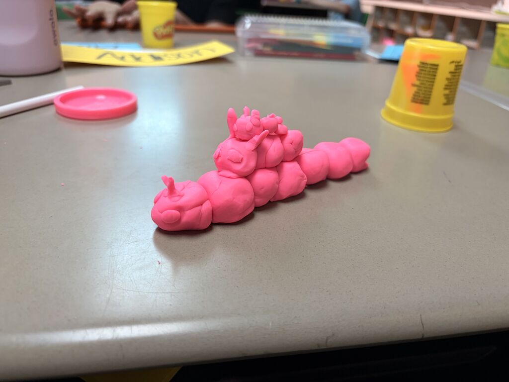 pink play-doh stacked on each other