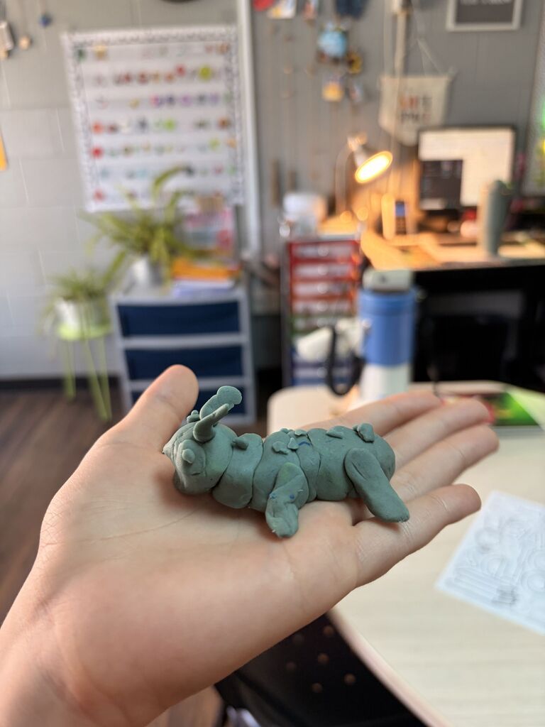 a green playdoh caterpillar 