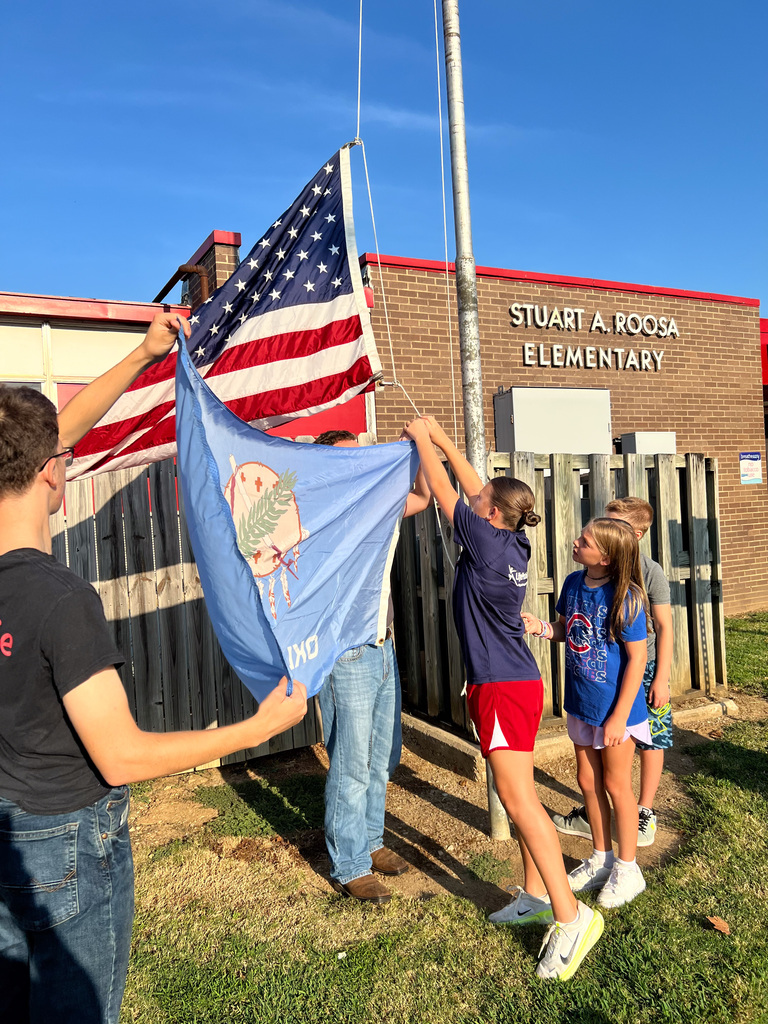 Roosa students learning about flag etiquette.
