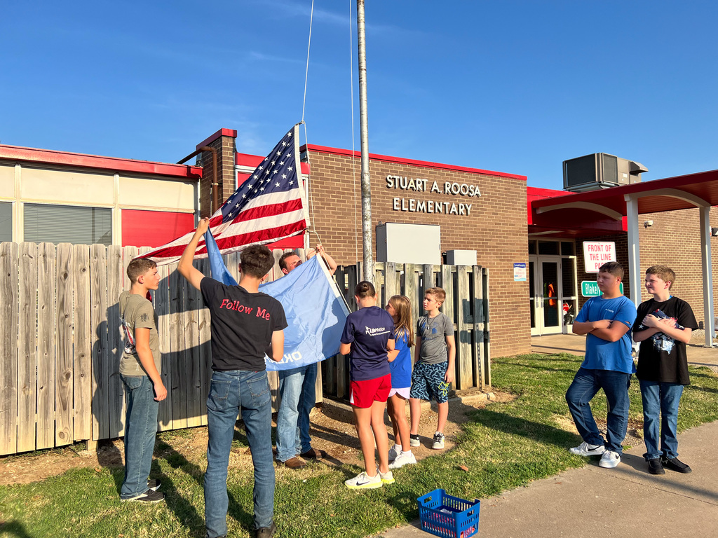 Roosa students learning about flag etiquette.