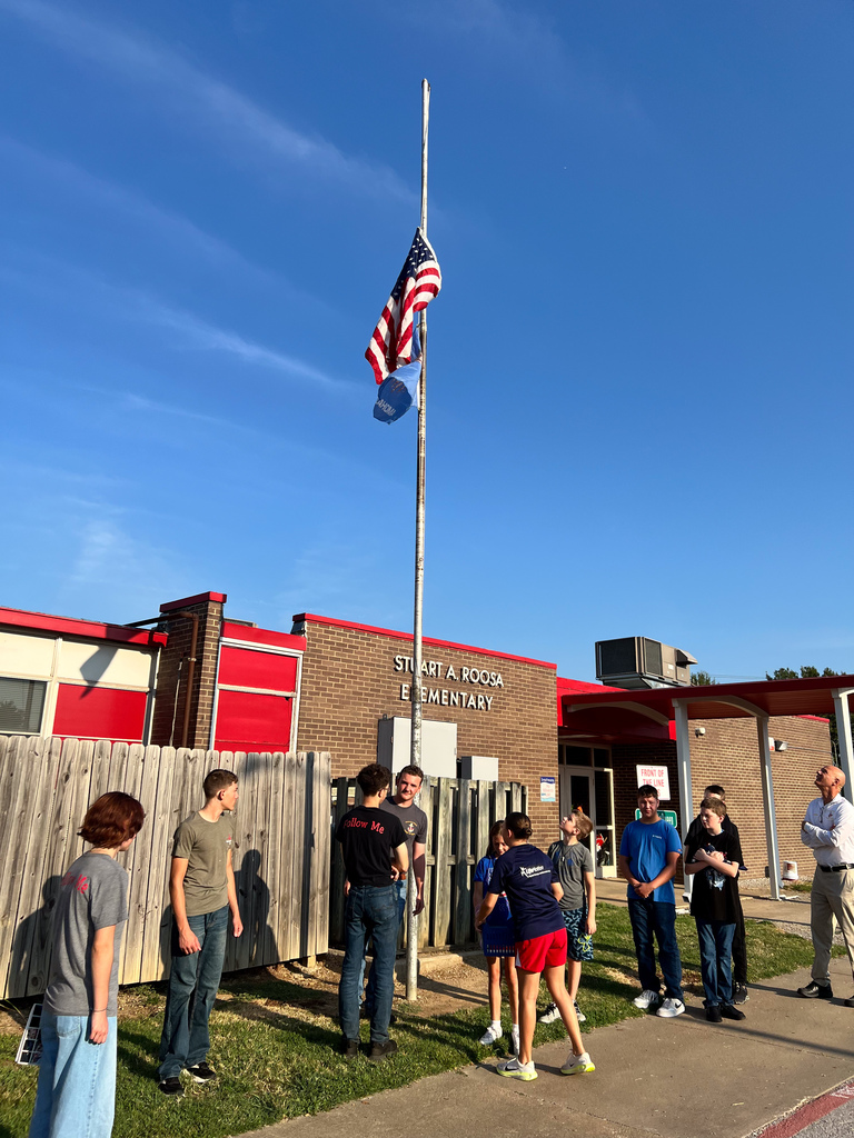 Roosa students learning about flag etiquette.