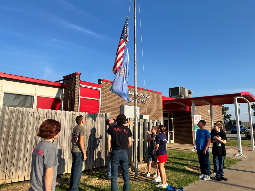 Roosa students learning about flag etiquette.