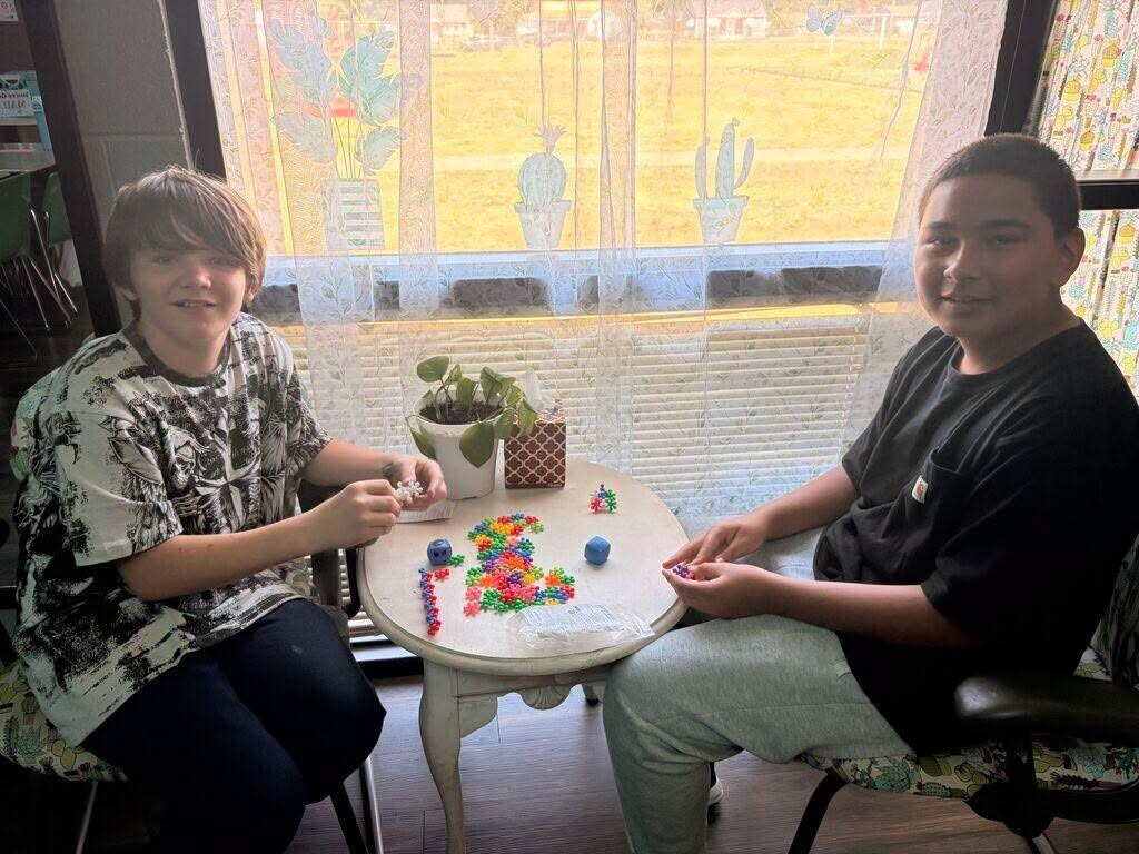 Elementary students working on team bonding with caterpillar.