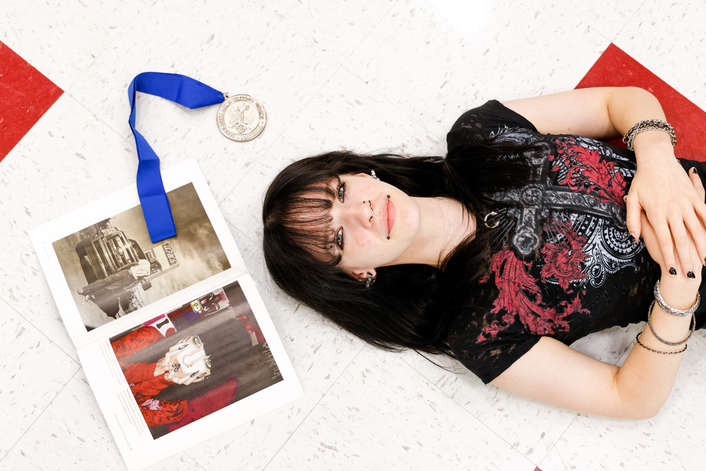 High school art student with her award