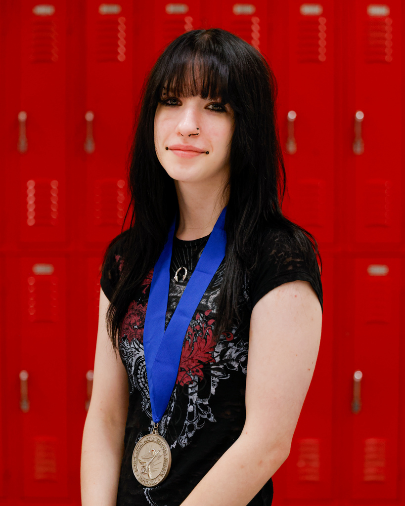 High school art student portait with her award