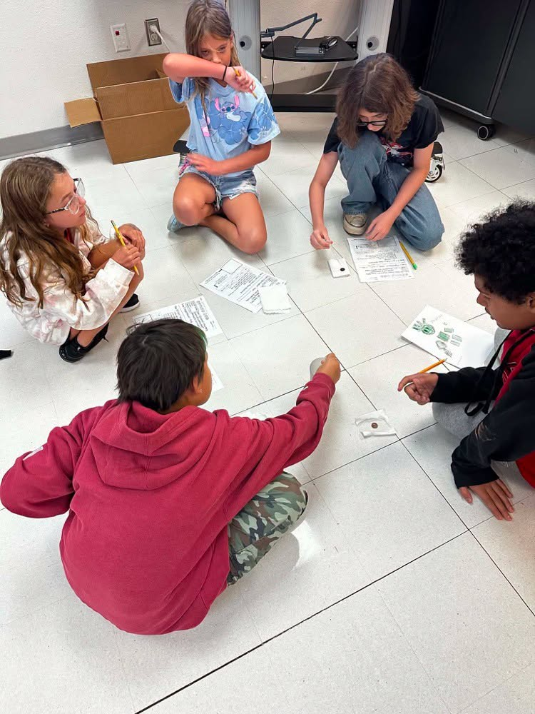 Students doing experiments with pennies
