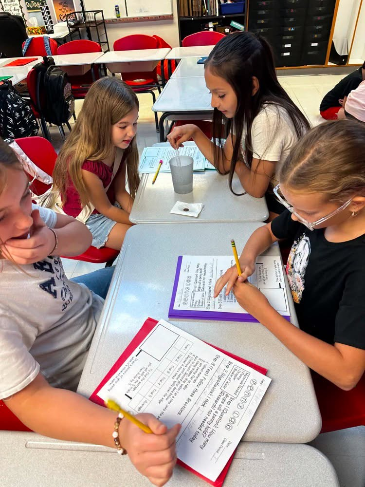 Students doing experiments with pennies
