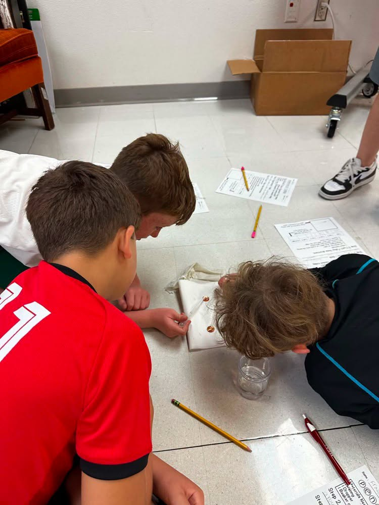 Students doing experiments with pennies