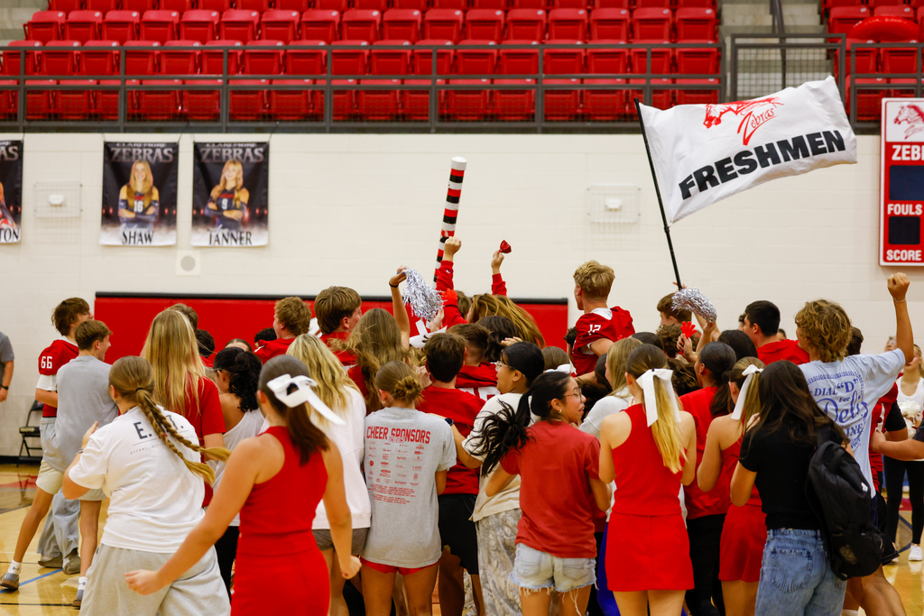 Freshman with spirit stick cheering 