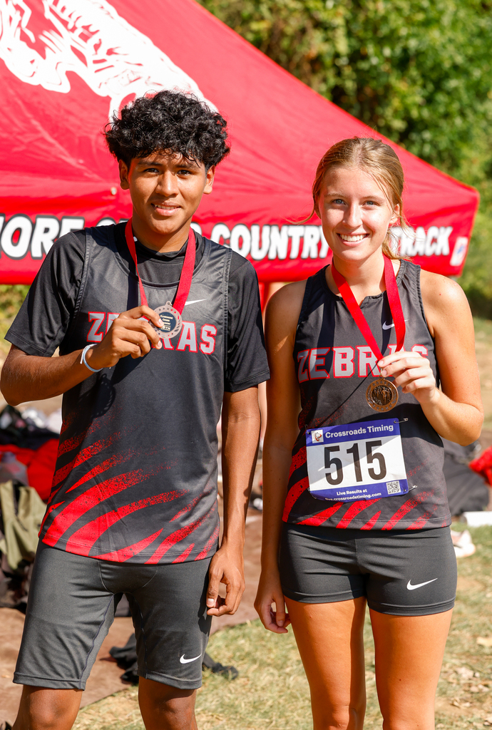 Cross Country runners with their metals