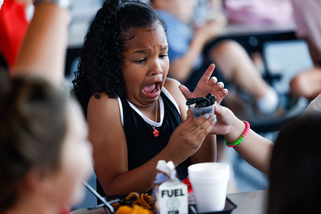 Elementary student terrified by the sight of squid ink pasta.