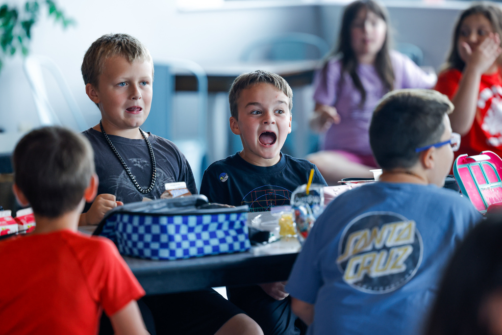 Elementary student frightened by the sight of squid ink pasta.