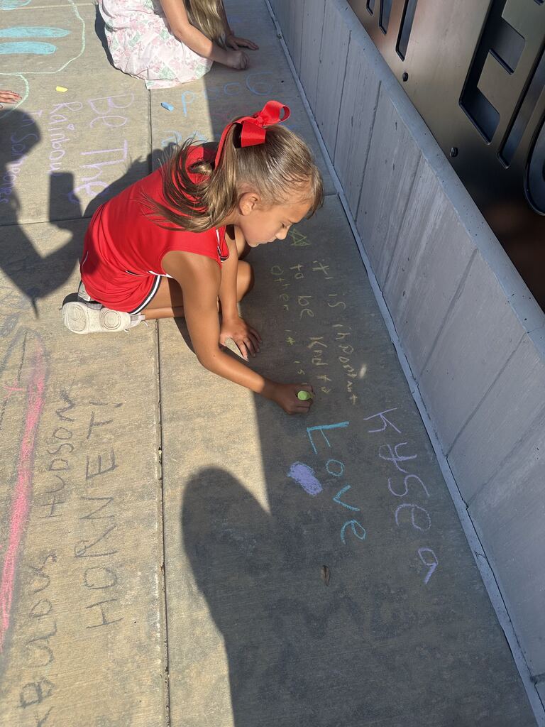 student coloring with chalk