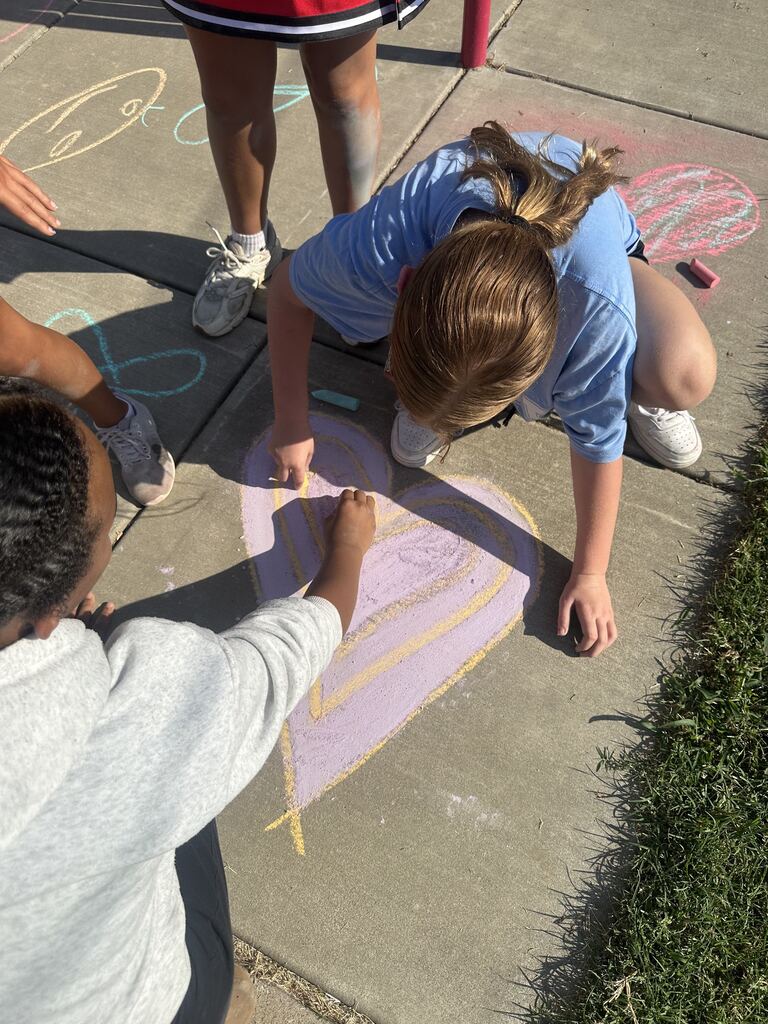 students coloring with chalk