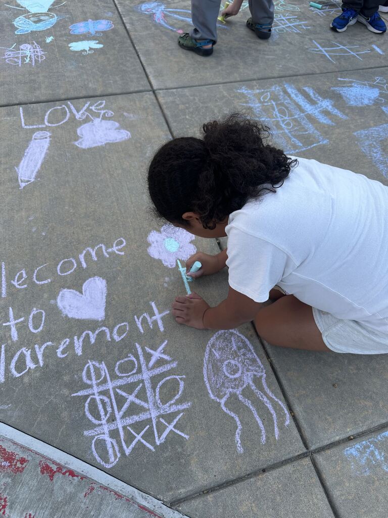 student coloring with chalk
