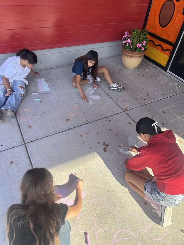 students coloring with chalk