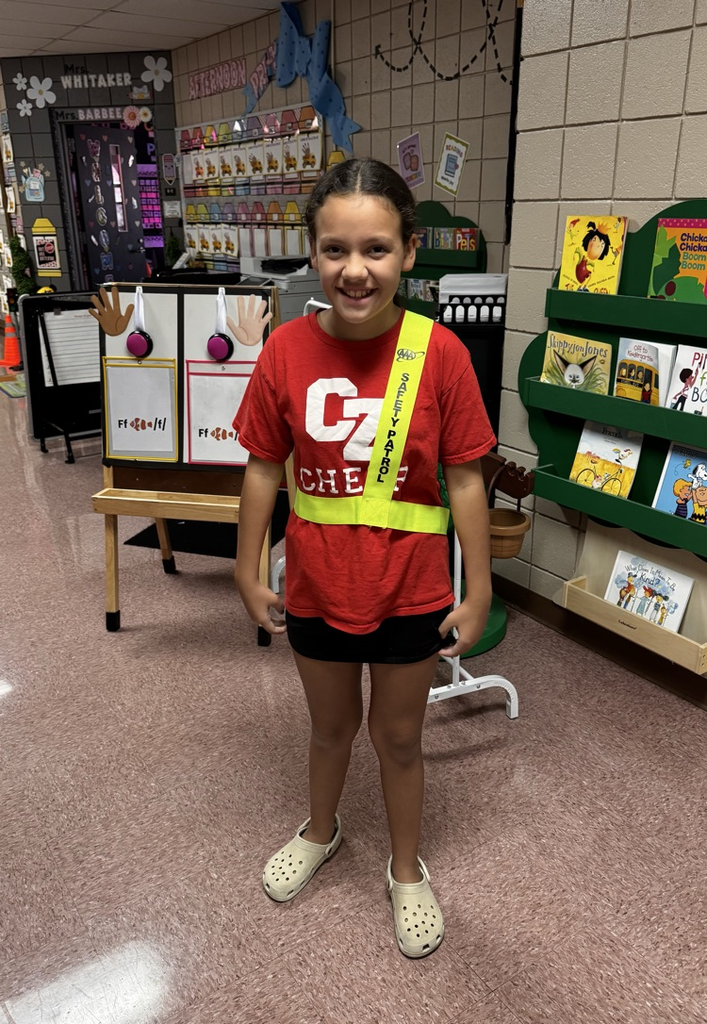 student in safety sash 