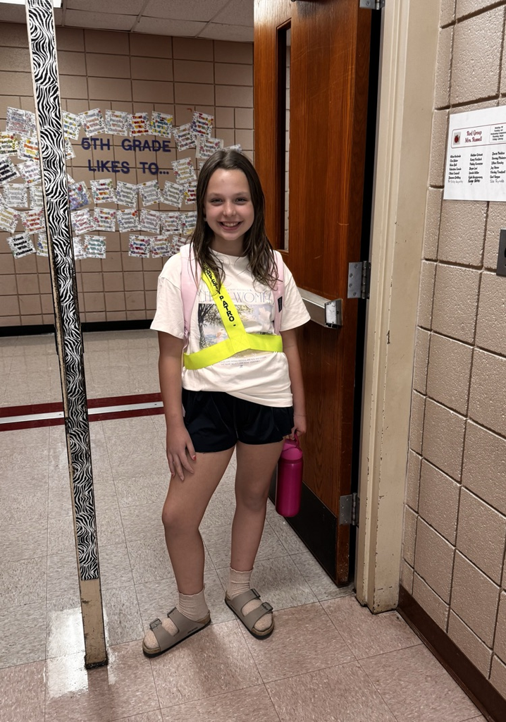 student in safety sash 