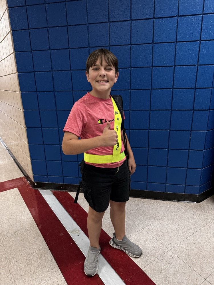 student in safety sash 