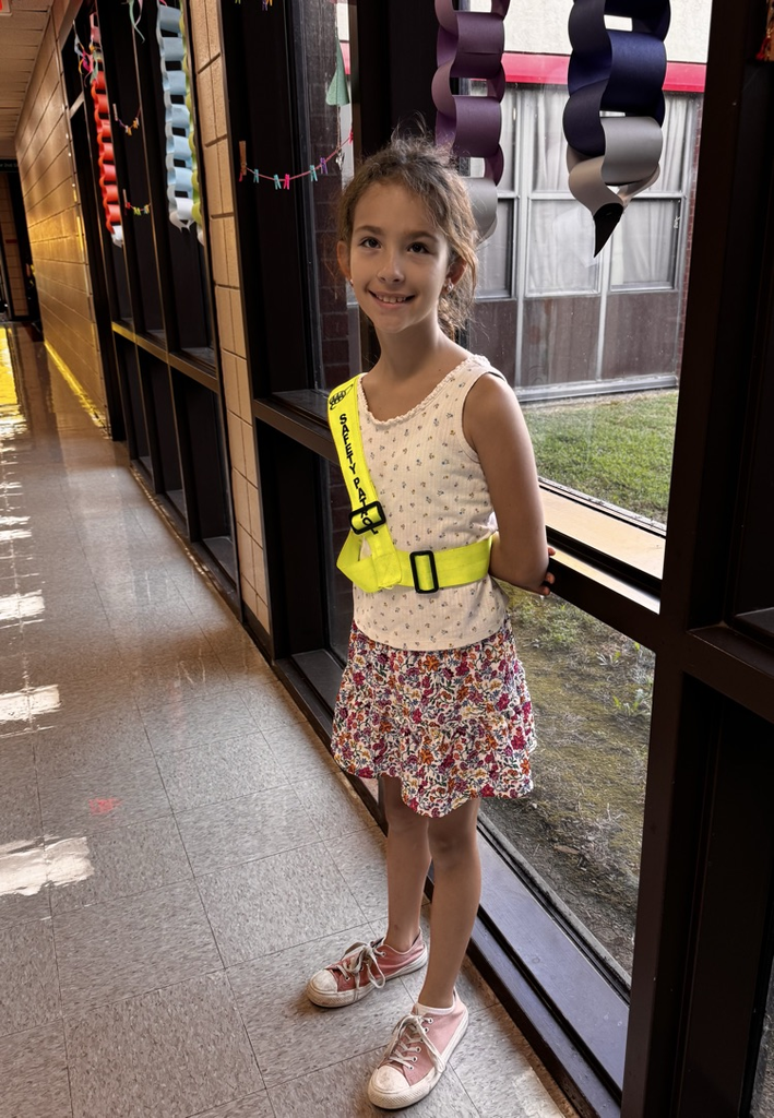student in safety sash 