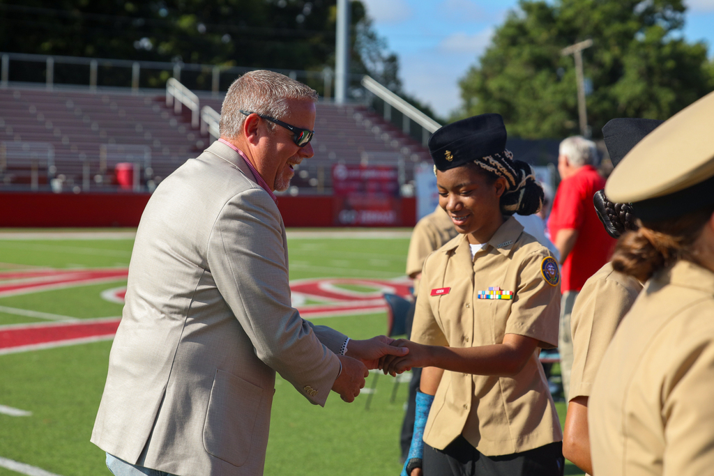 Veteran shacking NJROTC members hand
