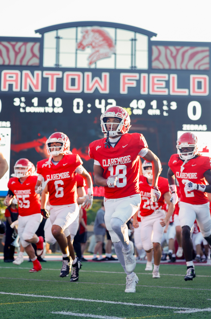 Football Players running out of the tunnel 