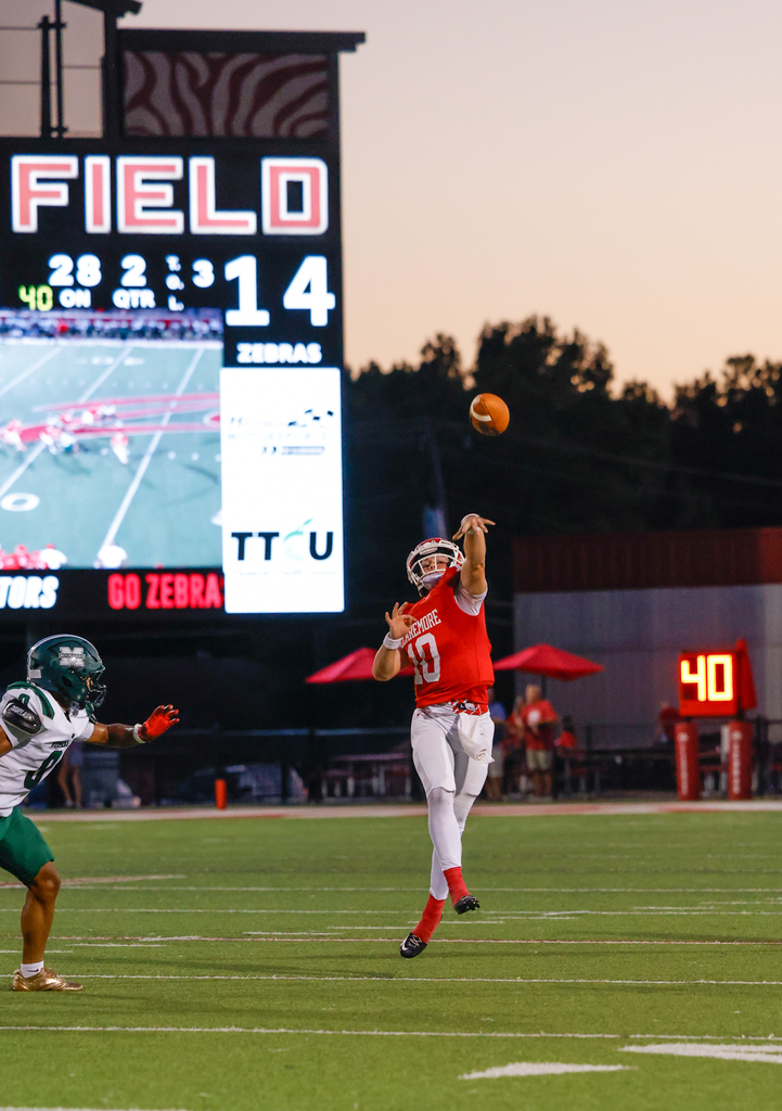 Football player throwing a pass