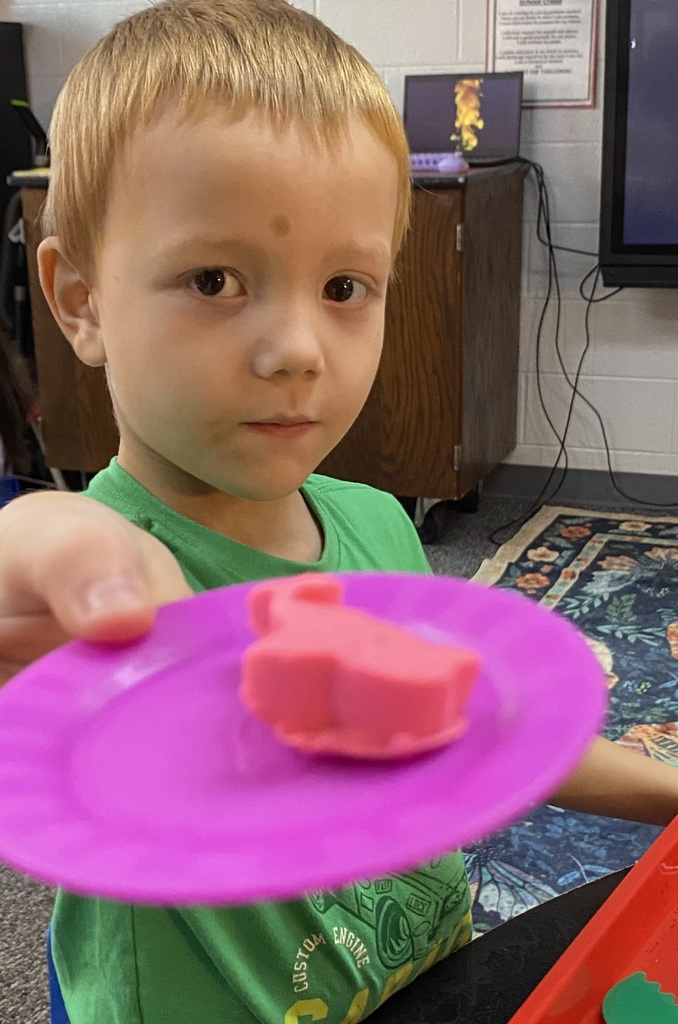 student showing playdoh