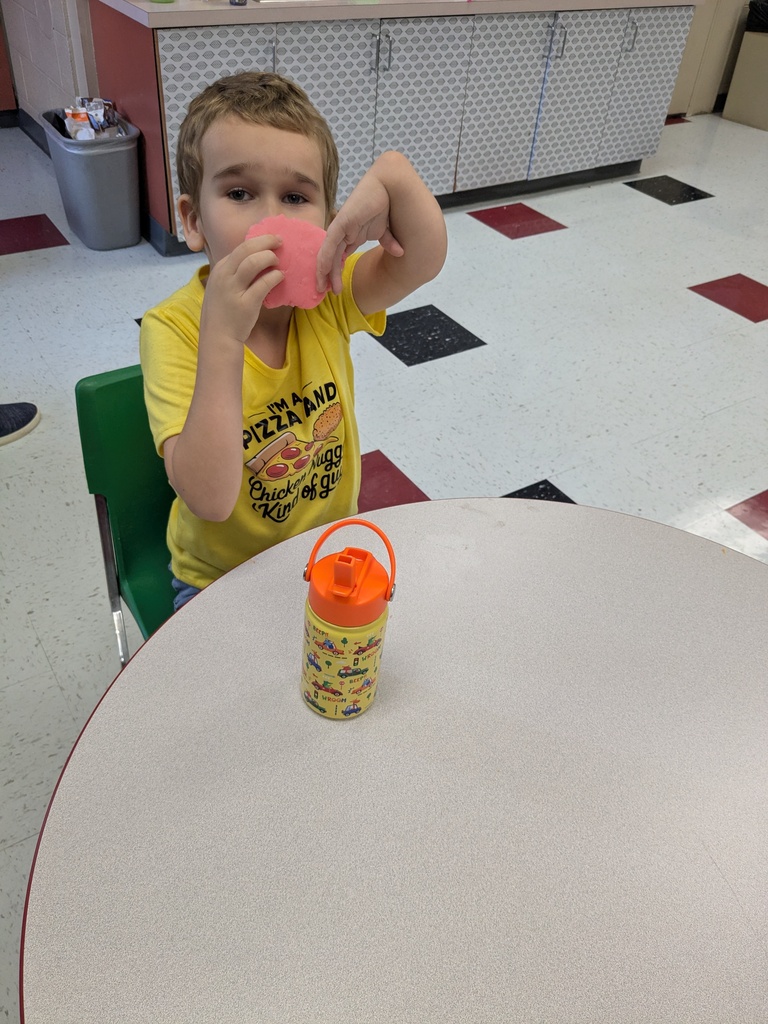 student showing off playdoh