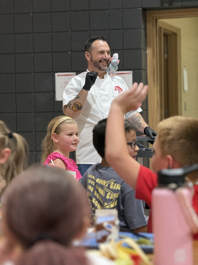 chef cheering with students
