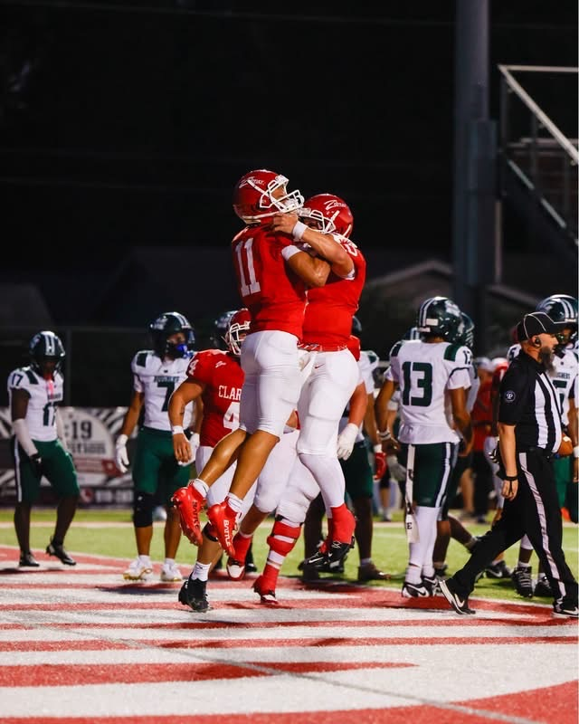 Football players jumping.